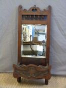 Late 19th/early 20thC wall mirror with bevelled edge and shelf below,
