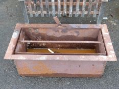 A cast iron fire grate,