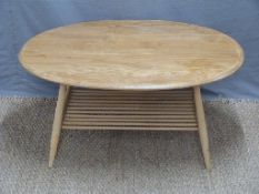 Retro light elm oval coffee table with rack under, possibly Ercol,