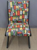 A retro ebonised designer chair upholstered in French 1950's fabric