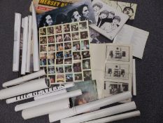 A collection of Beatles posters including a set of Merseybeat front page artwork,