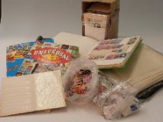 A box of catalogues and a box of loose stamps,