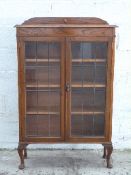Glazed oak bookcase with adjustable shelves,