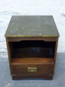 A campaign style bedside cabinet with tooled leather inset top,