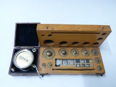 Cased revolution counter and a cased set of weights