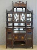 A 19thC rosewood inlaid display cabinet with bevelled glass, bevelled mirrors and pierced shelves,