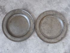 Two pewter platters, one with London touch marks,