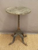 A cast iron garden or pub table,