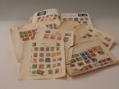 A Strand stamp album and loose album pages of Commonwealth and foreign stamps