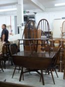 Ercol drop leaf dining table and four dining chairs,