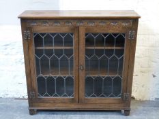 Old Charm or similar oak glazed bookcase