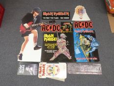 A collection of AC/DC and Iron Maiden standees,