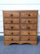 A pitch pine tabletop chest of ten drawers,