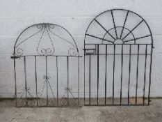 Two wrought iron style garden gates