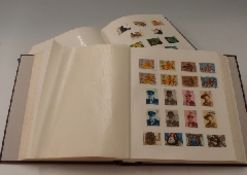 An album of GB stamps 1840-1990 and an album of mint commemorative stamps 1989-2006