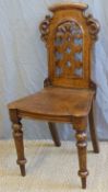 A 19thC oak pierced shield back chair