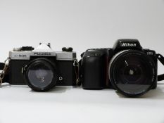 Nikon F50 SLR camera with Sigma 28-200mm lens and a Fujica ST605 SLR camera with Cosinon f= 55m F=2.