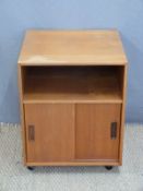 A retro cabinet with sliding doors,