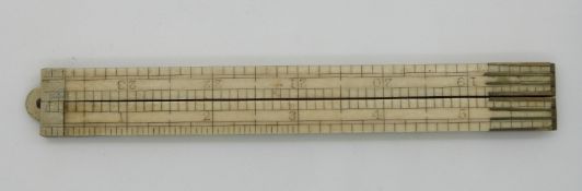A 19thC/early 20thC ivory four section folding 24 inch ruler
