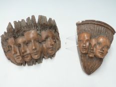 Two Goldscheider-style terracotta wall brackets,