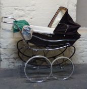 Marmet vintage pram in brown with hood and cover with an additional green fringed canopy,
