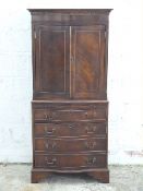 Reproduction serpentine fronted chest with cupboard to top, the lower section with brushing slide,