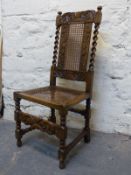 A carved oak bergere chair