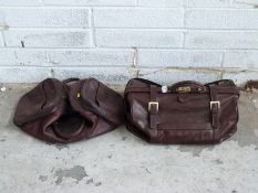 Two leather bags/holdalls marked Jasper Conran and Gianni Conte
