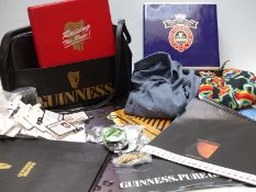 A quantity of Guinness related and other breweriana related ephemera to include tokens, badges,