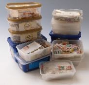 A substantial accumulation of loose stamps, mainly sorted by country into plastic boxes,
