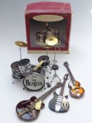 Beatles Hallmark Keepsake ornament in original box along with three replica model guitars in