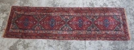 Turkoman woollen rug or runner with red guls,