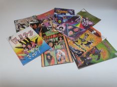Various music comics relating to Kiss, Pink Floyd, heavy metal,