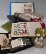 A crate of stamps, albums and covers including an album of space travel stamps,