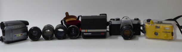 Asahi Pentax SP500 SLR camera with various lenses including Hanimar 135mm,