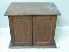 A small oak freestanding cabinet,
