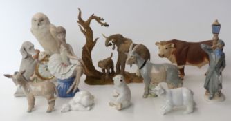 A group of eleven porcelain and resin figures including Nao, a Franklin Mint figural owl clock,