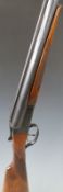 Biakial 12 bore side by side shotgun with named and engraved lock, chequered grip and forend and 27.
