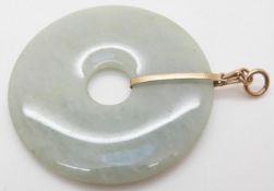 A jadeite bi-disc with 9ct gold pendant fittings, 5.
