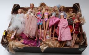 Approximately thirty Barbie dolls of differing ages