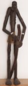 Carved wood tribal figure with staff,