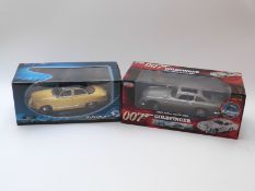 Two diecast model cars JoyRide RC2 James Bond 007 Goldfinger 1965 Aston Martin DB5 80792 and Solido