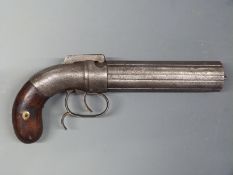 A large six-shot percussion hammer action pepperbox revolver with belt hook, spurred trigger guard,
