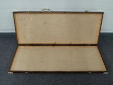 A hinged wooden box/ carry case suitable for guns,