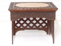 A 19thC Anglo Indian / Sri Lankan scribe's campaign desk with shaped mahogany cartouche and