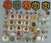 A collection of Soviet Union / Russian military and civic badges,