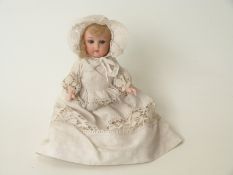 Heubach Koppelsdorf bisque headed doll with open mouth, weighted blue eyes,