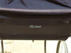 Marmet vintage pram in brown with hood and cover with an additional green fringed canopy,