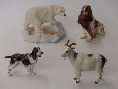 Four Royal Doulton figures including a spaniel with pheasants, polar bear DA155,
