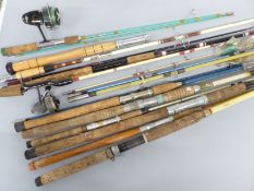 A collection of vintage fishing rods with fixed spool reels
